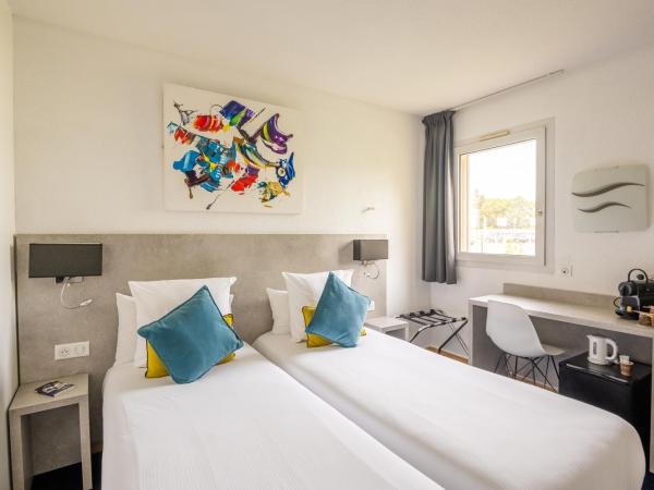 Hôtel Restaurant Le Clos Fleuri : photo 1 de la chambre chambre lits jumeaux