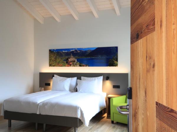 Charme Hotel al Torchio : photo 3 de la chambre chambre familiale triple moderne