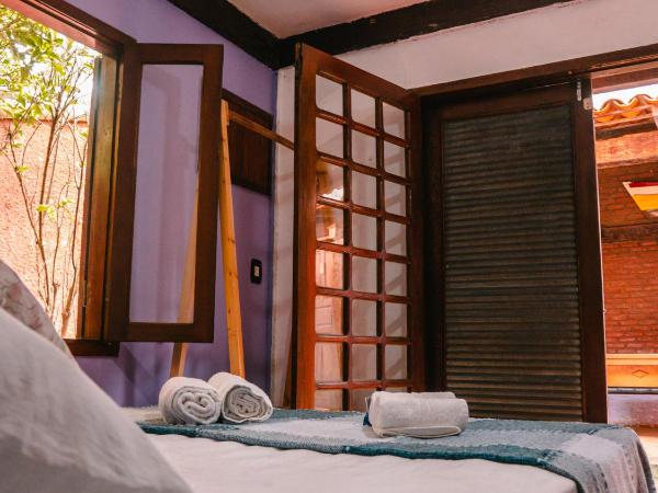 Numa Boa HOSTEL Búzios : photo 6 de la chambre chambre quadruple avec salle de bains commune