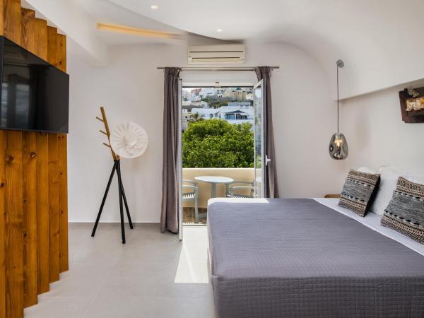 Alizea Villas & Suites : photo 7 de la chambre suite lit king-size avec baignoire spa