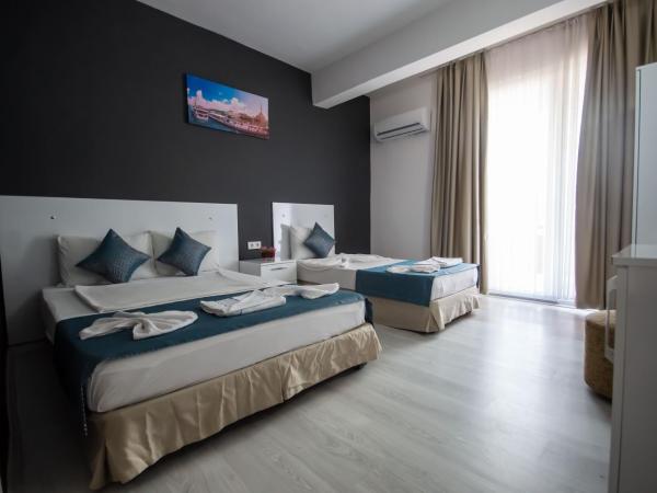 MOONBOW BEACH HOTEL : photo 5 de la chambre chambre familiale - vue sur mer