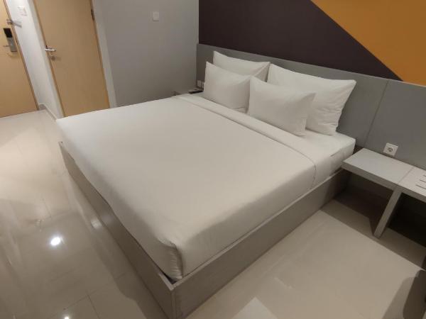 Agogo Downtown Hotel Surabaya : photo 2 de la chambre chambre lit king-size supérieure