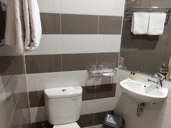 Agogo Downtown Hotel Surabaya : photo 3 de la chambre chambre triple