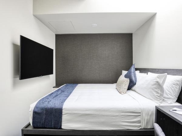 Microtel by Wyndham Wellington : photo 1 de la chambre chambre lit queen-size 