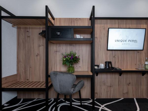 Hotel Unique Pearl : photo 2 de la chambre chambre double familiale