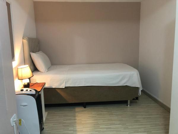 Hostel Ipê : photo 5 de la chambre chambre triple avec salle de bains privative
