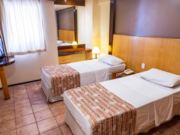 Plaza Praia Suítes : photo 3 de la chambre chambre quadruple de luxe