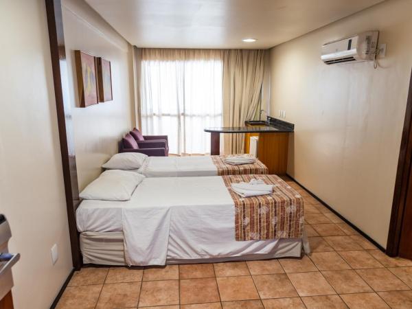 Plaza Praia Suítes : photo 2 de la chambre chambre quadruple de luxe