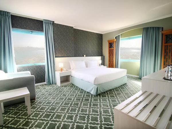 The George Hotel by Saffron, Dubai Creek : photo 7 de la chambre suite d'angle - vue sur crique et quartier heritage