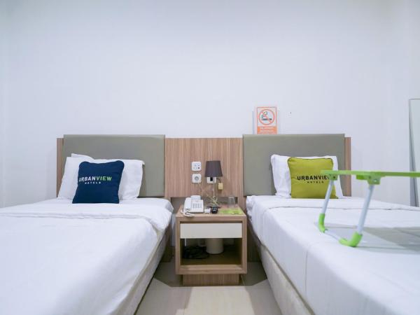 Urbanview Hotel Bes Mangga Besar by RedDoorz : photo 3 de la chambre chambre lits jumeaux deluxe