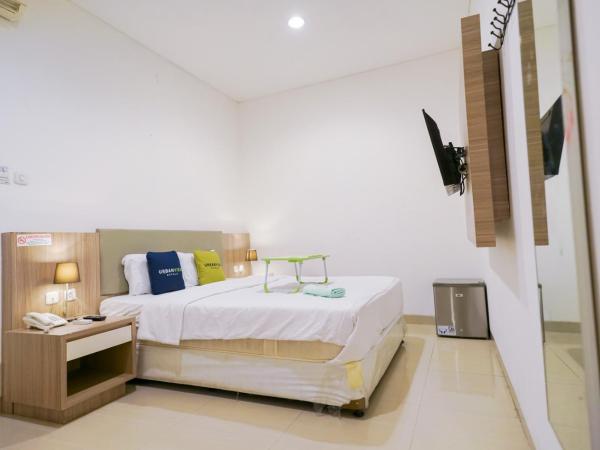 Urbanview Hotel Bes Mangga Besar by RedDoorz : photo 4 de la chambre chambre deluxe