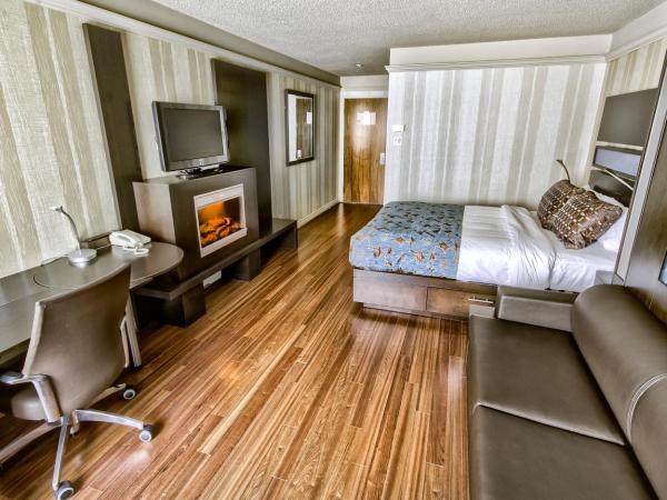 Hôtel Québec Inn : photo 1 de la chambre chambre moderne avec lit queen-size, lit queen-size escamotable et cheminée - vue sur extérieur