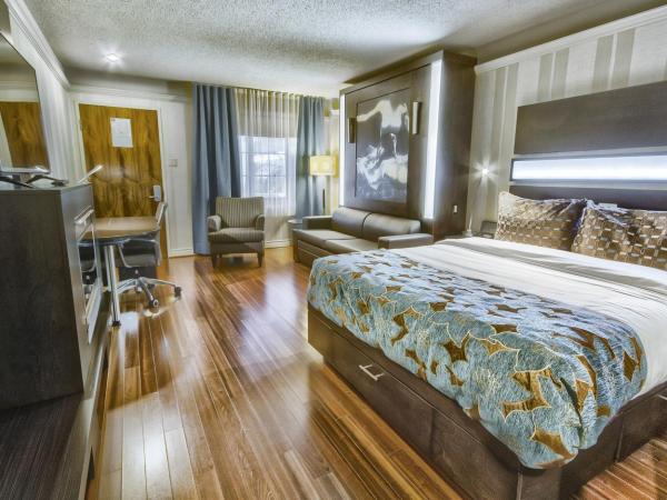 Hôtel Québec Inn : photo 3 de la chambre chambre moderne avec lit queen-size, lit queen-size escamotable et cheminée - vue sur intérieur