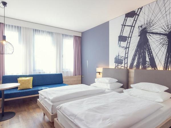 roomz Vienna Prater : photo 3 de la chambre chambre lits jumeaux style roomz avec banc