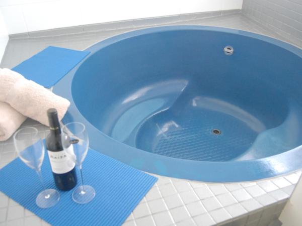 Rotorua Motel : photo 4 de la chambre studio lit queen-size avec spa