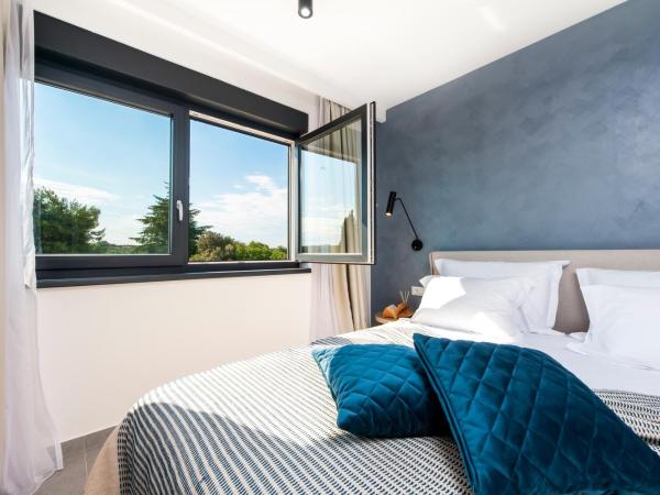 Luxury Residence Levante : photo 2 de la chambre chambre lit king-size deluxe