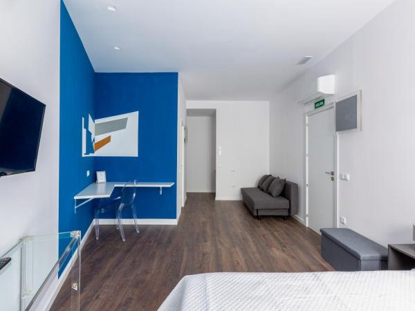 Ronda9 central suites : photo 5 de la chambre chambre deluxe avec 2 lits queen-size