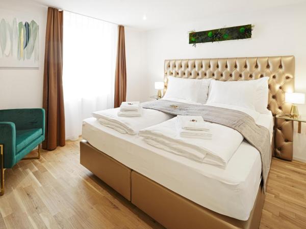 EH Apartments Saturn : photo 1 de la chambre suite deluxe avec lit king-size