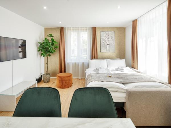 EH Apartments Saturn : photo 10 de la chambre suite deluxe avec lit king-size