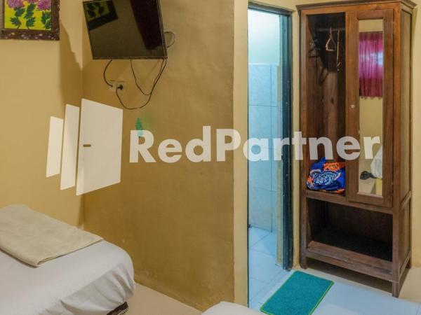 Vandhela Homestay Syariah Mitra RedDoorz : photo 3 de la chambre chambre lits jumeaux