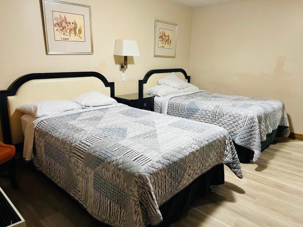 Sunset Inn : photo 1 de la chambre chambre standard avec 2 lits doubles - non-fumeurs