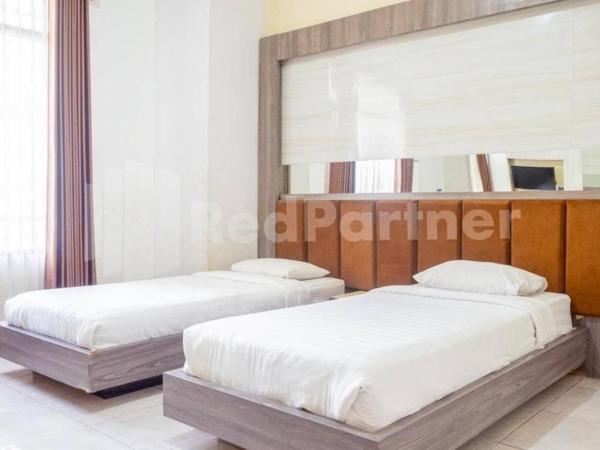 My Hommy Homestay Mitra RedDoorz : photo 3 de la chambre chambre lits jumeaux