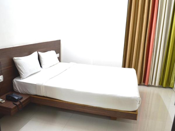 Grand Suites Yelahanka : photo 3 de la chambre chambre double ou lits jumeaux