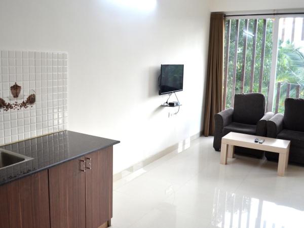 Grand Suites Yelahanka : photo 6 de la chambre chambre double deluxe avec balcon
