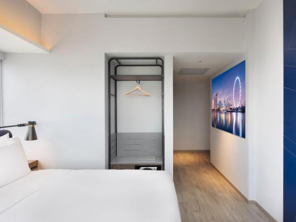 Travelodge Harbourfront Singapore : photo 4 de la chambre hébergement lit queen-size deluxe plus