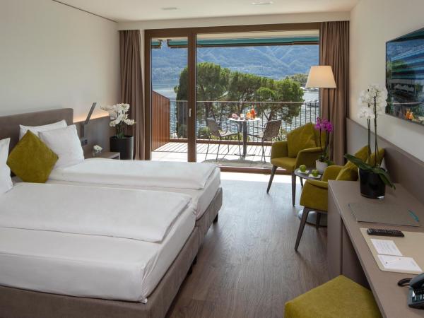 Hotel Lago Maggiore - Welcome! : photo 10 de la chambre chambre double ou lits jumeaux exclusive avec vue sur le lac