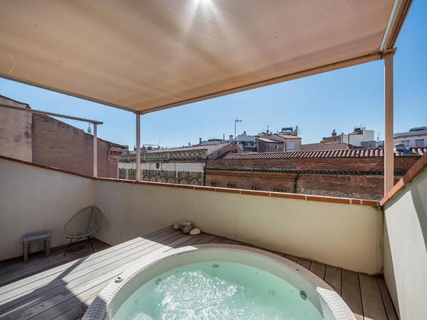 La Loge de mer, Lodge urbain : photo 1 de la chambre suite avec bain à remous (Été uniquement)