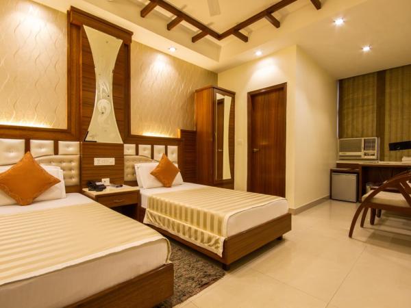 Hotel Aster Inn New Delhi : photo 2 de la chambre chambre deluxe