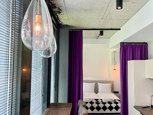 NEON APARTMENTS : photo 3 de la chambre appartement supérieur