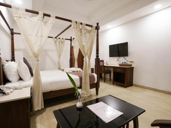 Once Upon The River, Aluva - Near Cochin International Airport : photo 3 de la chambre chambre lit king-size - vue sur jardin