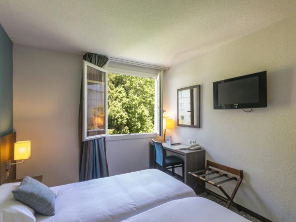 Hôtel Miramont : photo 1 de la chambre chambre lits jumeaux - vue sur jardin