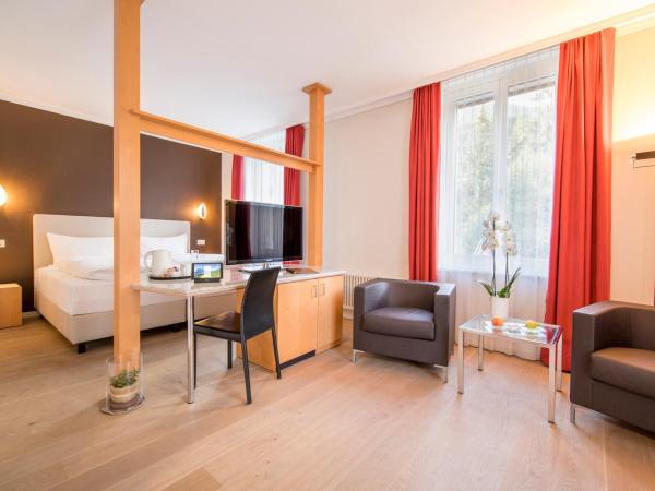 Belvedere Swiss Quality Hotel : photo 1 de la chambre chambre double deluxe - climatisation - vue sur jardin