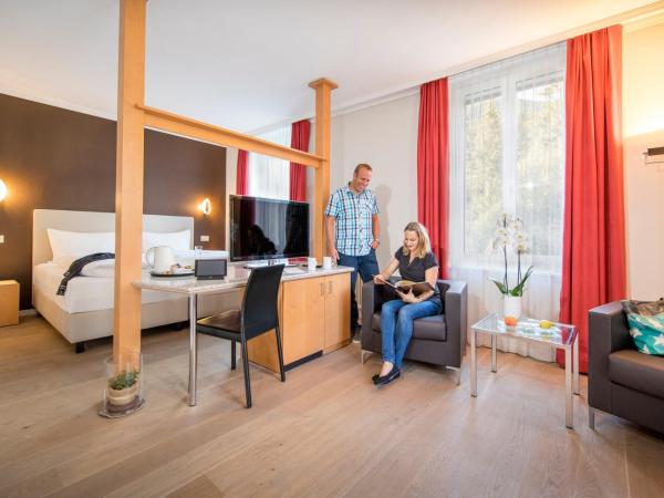 Belvedere Swiss Quality Hotel : photo 2 de la chambre chambre double deluxe - climatisation - vue sur jardin