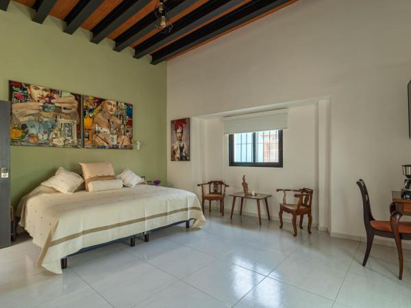 LARIMAR Gallery y Hotel Boutique : photo 8 de la chambre chambre lit king-size supérieure