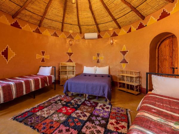Ecolodge La Palmeraie : photo 3 de la chambre bungalow - vue sur jardin