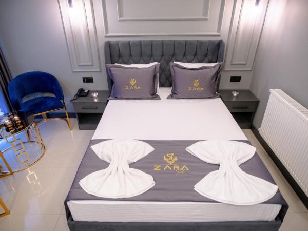 ZaraSuit : photo 1 de la chambre chambre double avec lit d'appoint