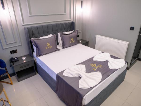 ZaraSuit : photo 4 de la chambre chambre double avec lit d'appoint