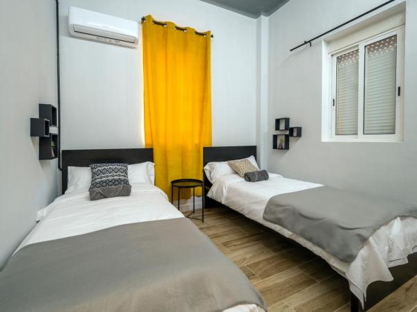 The Venue Hostel Boutique : photo 2 de la chambre chambre double ou lits jumeaux avec salle de bains commune