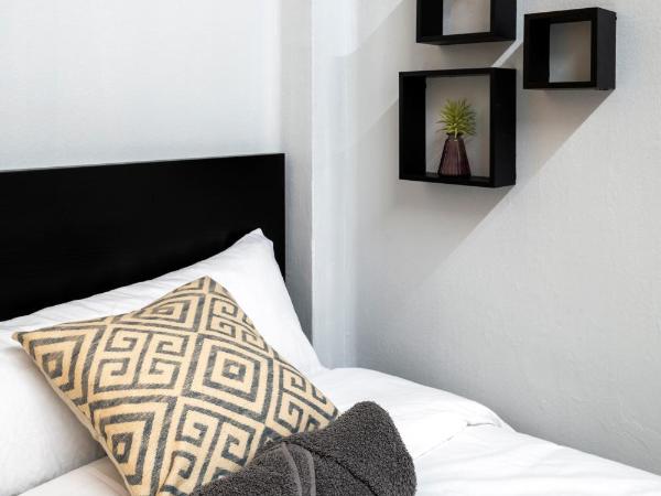 The Venue Hostel Boutique : photo 3 de la chambre chambre double ou lits jumeaux avec salle de bains commune