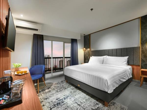 Aston Inn Jemursari : photo 1 de la chambre hébergement deluxe