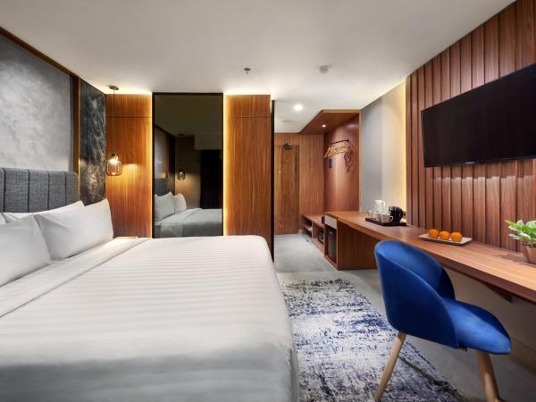 Aston Inn Jemursari : photo 2 de la chambre hébergement deluxe
