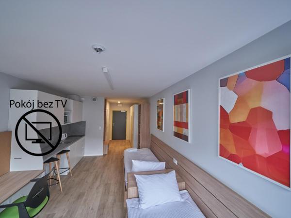 Apartamenty Collegia : photo 1 de la chambre chambre lits jumeaux spacieuse