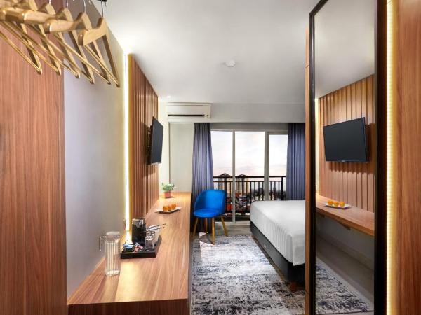 Aston Inn Jemursari : photo 3 de la chambre hébergement deluxe