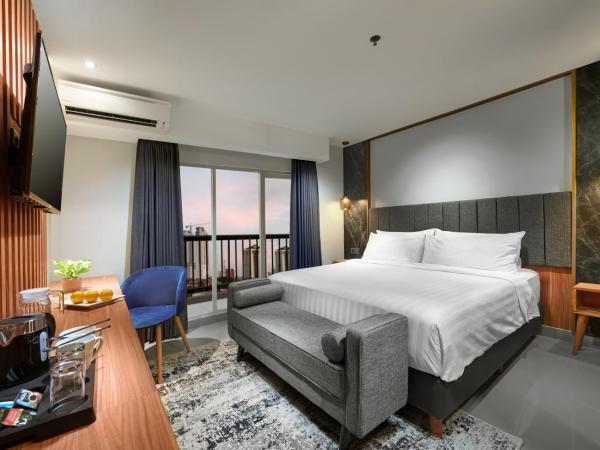 Aston Inn Jemursari : photo 1 de la chambre chambre de luxe premier