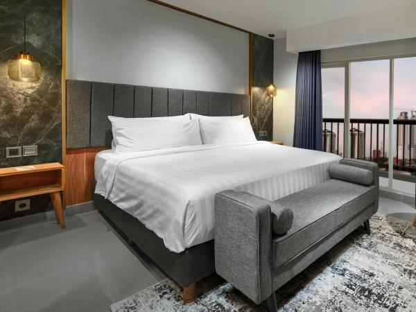 Aston Inn Jemursari : photo 3 de la chambre chambre de luxe premier