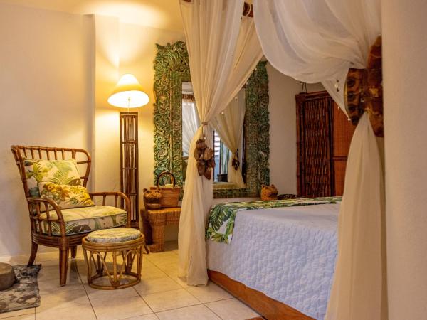 Monyoli Hotel & Boutique : photo 2 de la chambre suite lit king-size avec baignoire spa